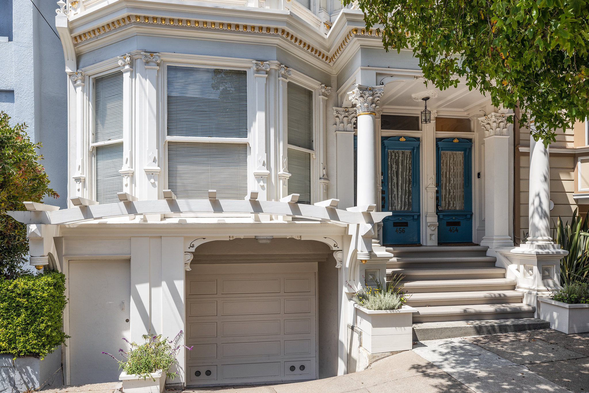 Front exterior of 454 Frederick Street, showing the garage door and front entry