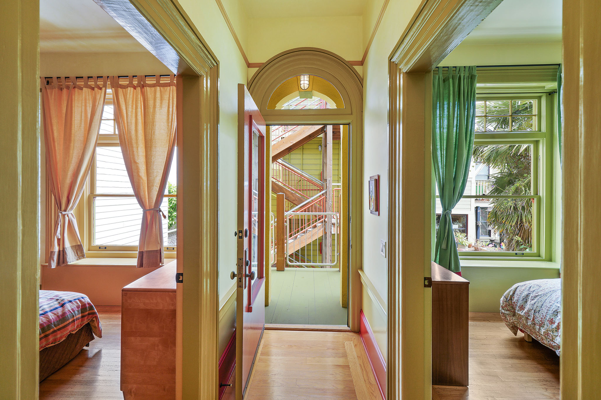 View of a hallway, with two adjoining bedrooms