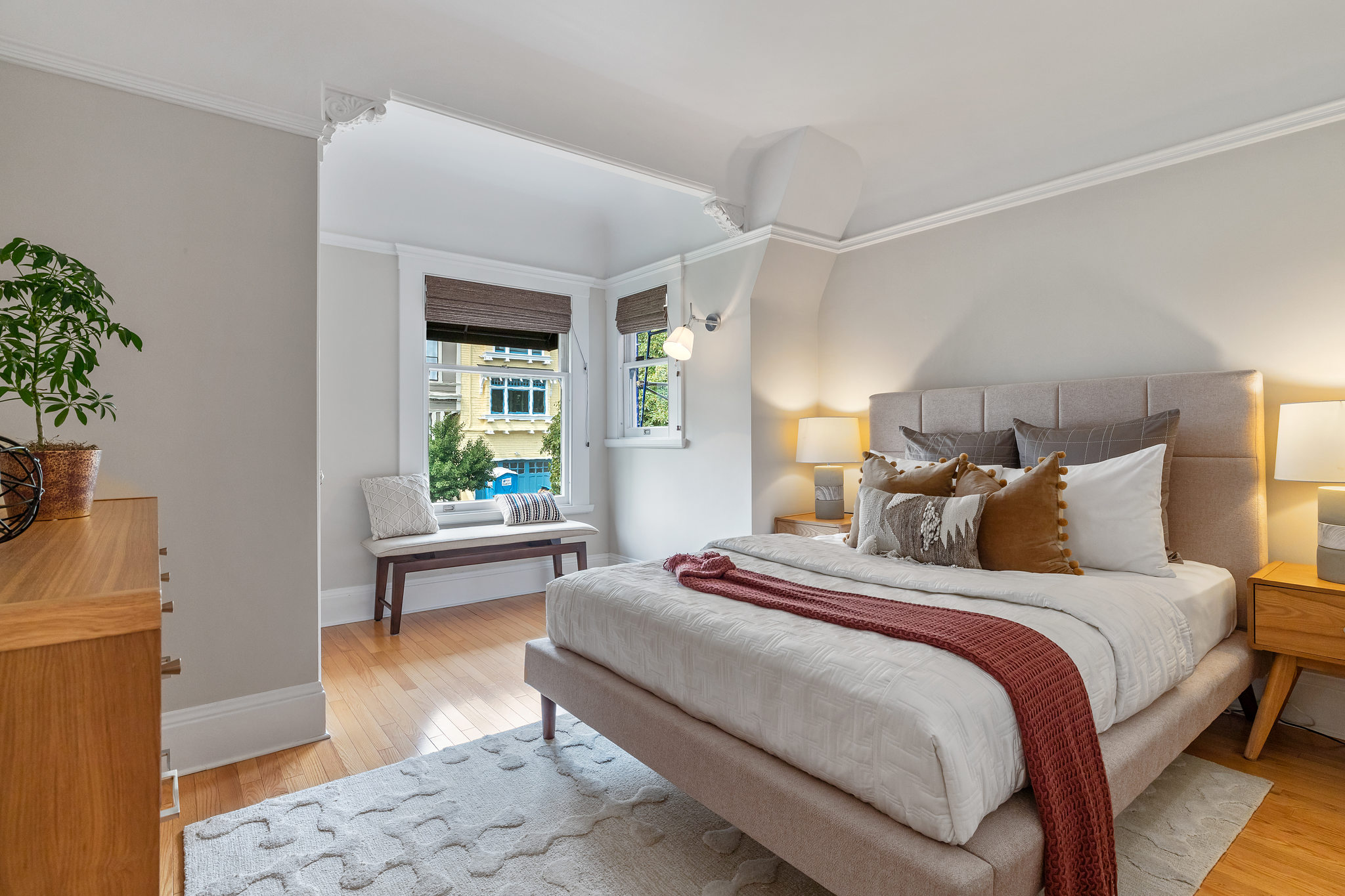 Large bedroom, with wood floors and sitting area