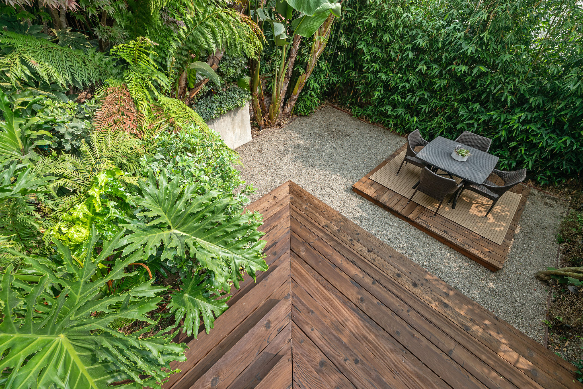 View of the yard with deck and outdoor dining space