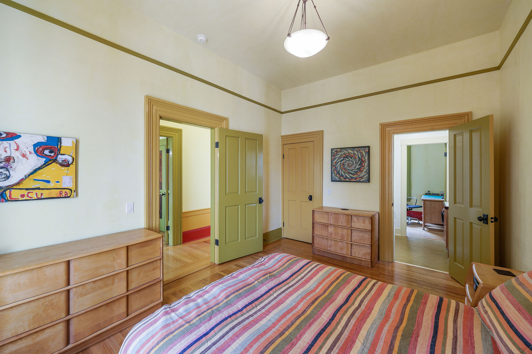 View of another bedroom with dual entry and wood floors