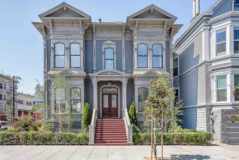 Front exterior view of  601 Broderick, showing a large home with blue facade