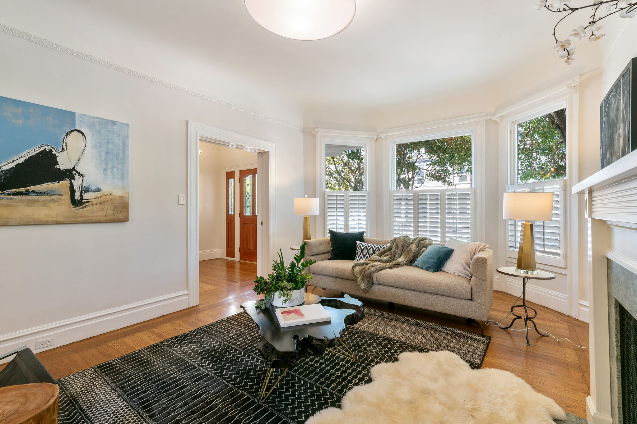717-cole-street.37789.p3k.07.web Living room showing bay windows and white woodwork