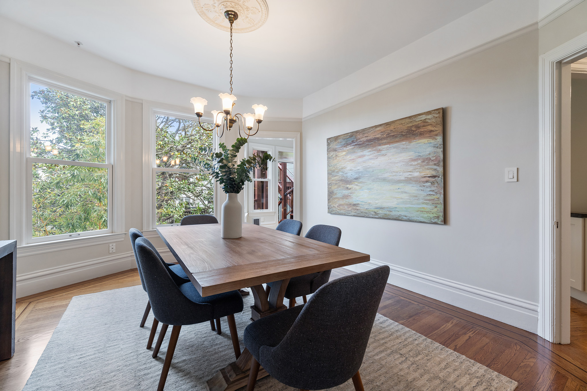 View of the dining rooms beautiful woodwork and large windows