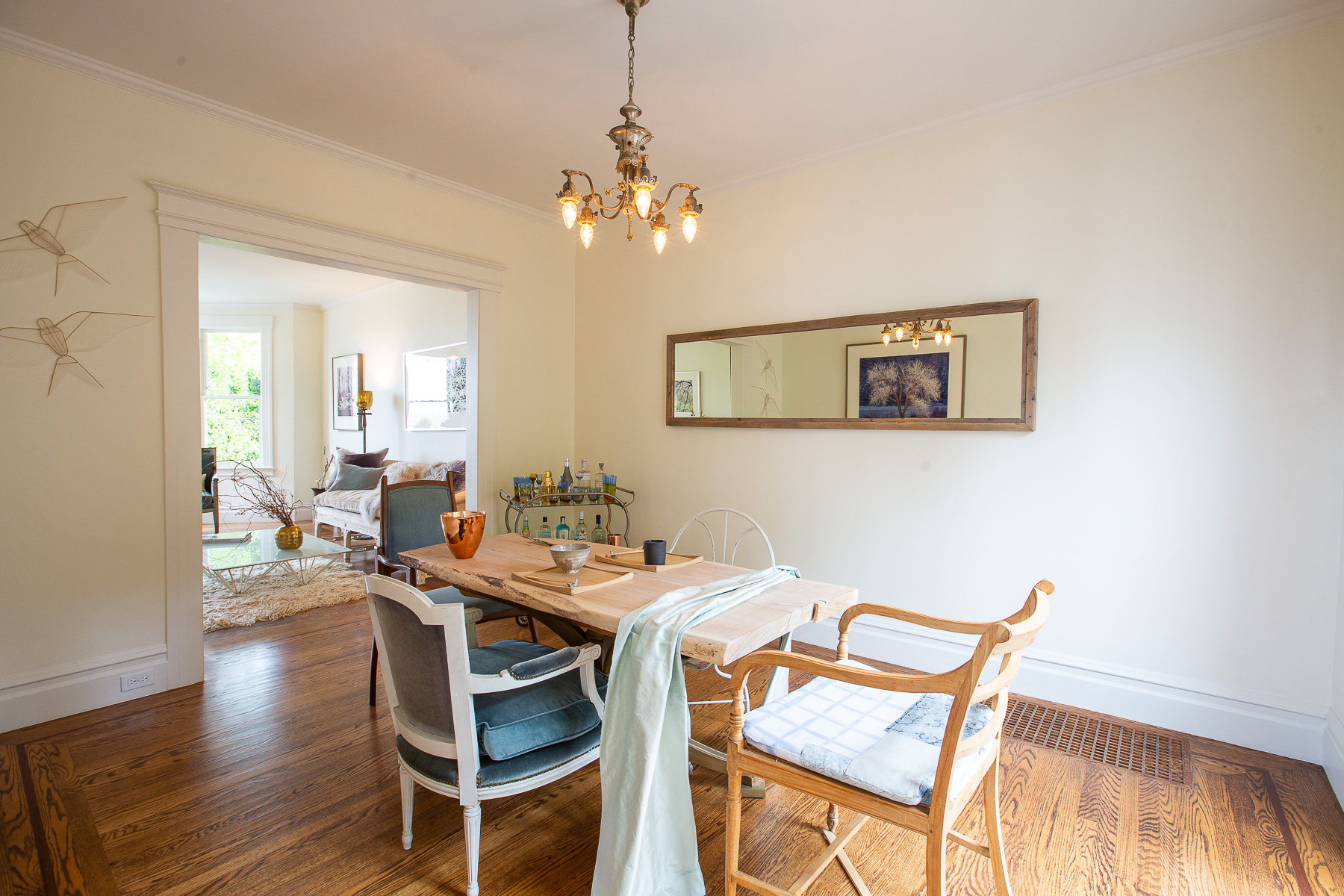 View of the dining room with rustic wood floors