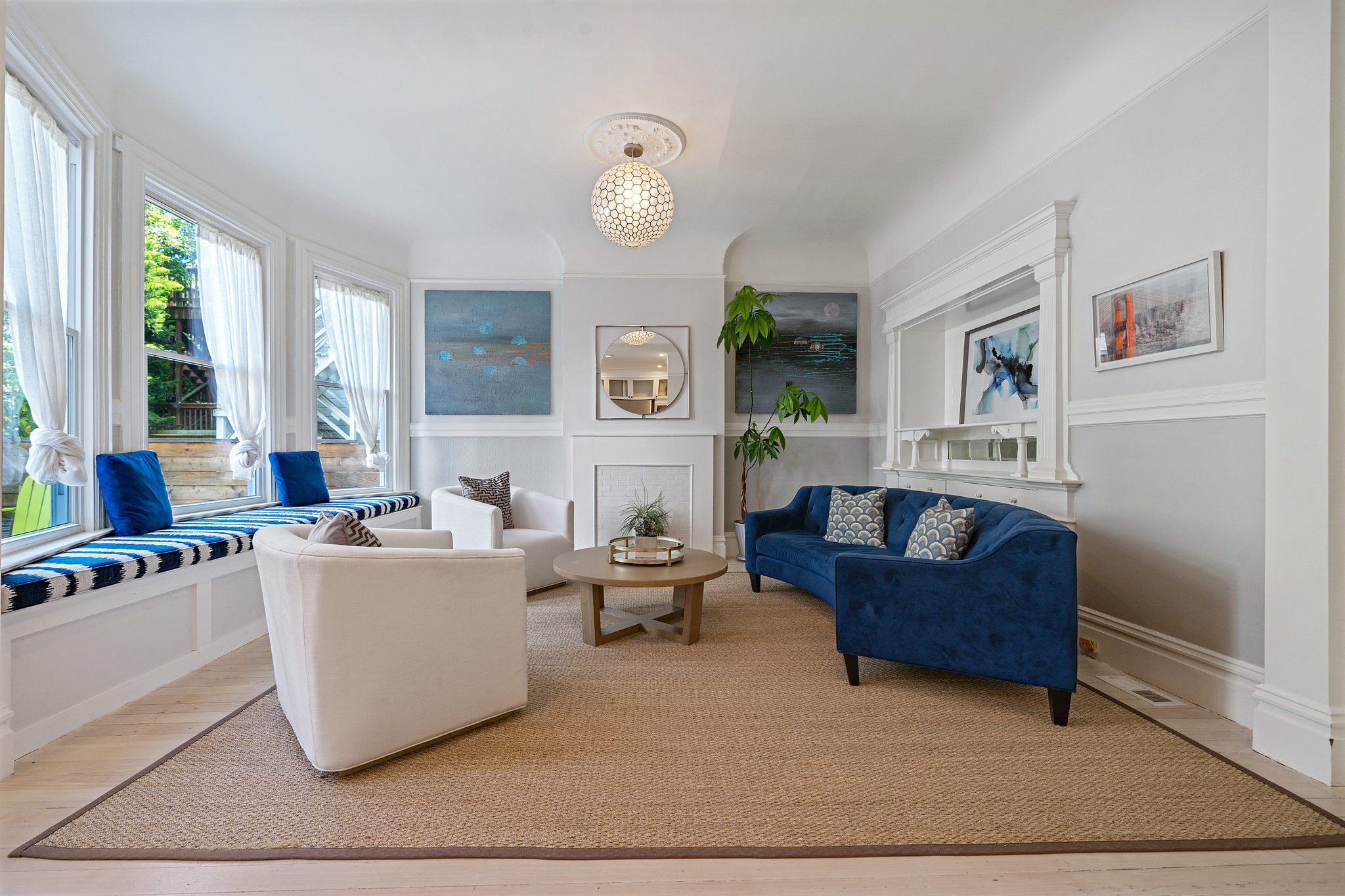 View of a living room with wood floor and plenty of natural light