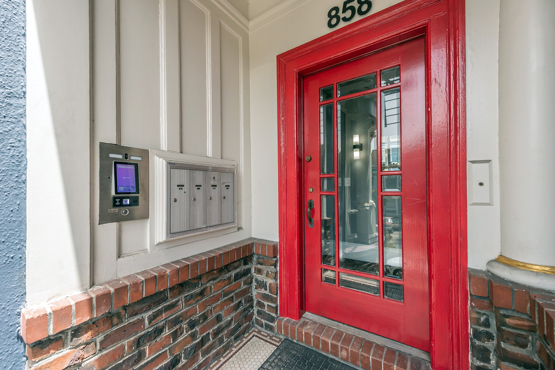 A red front door with entry to 858 Ashbury