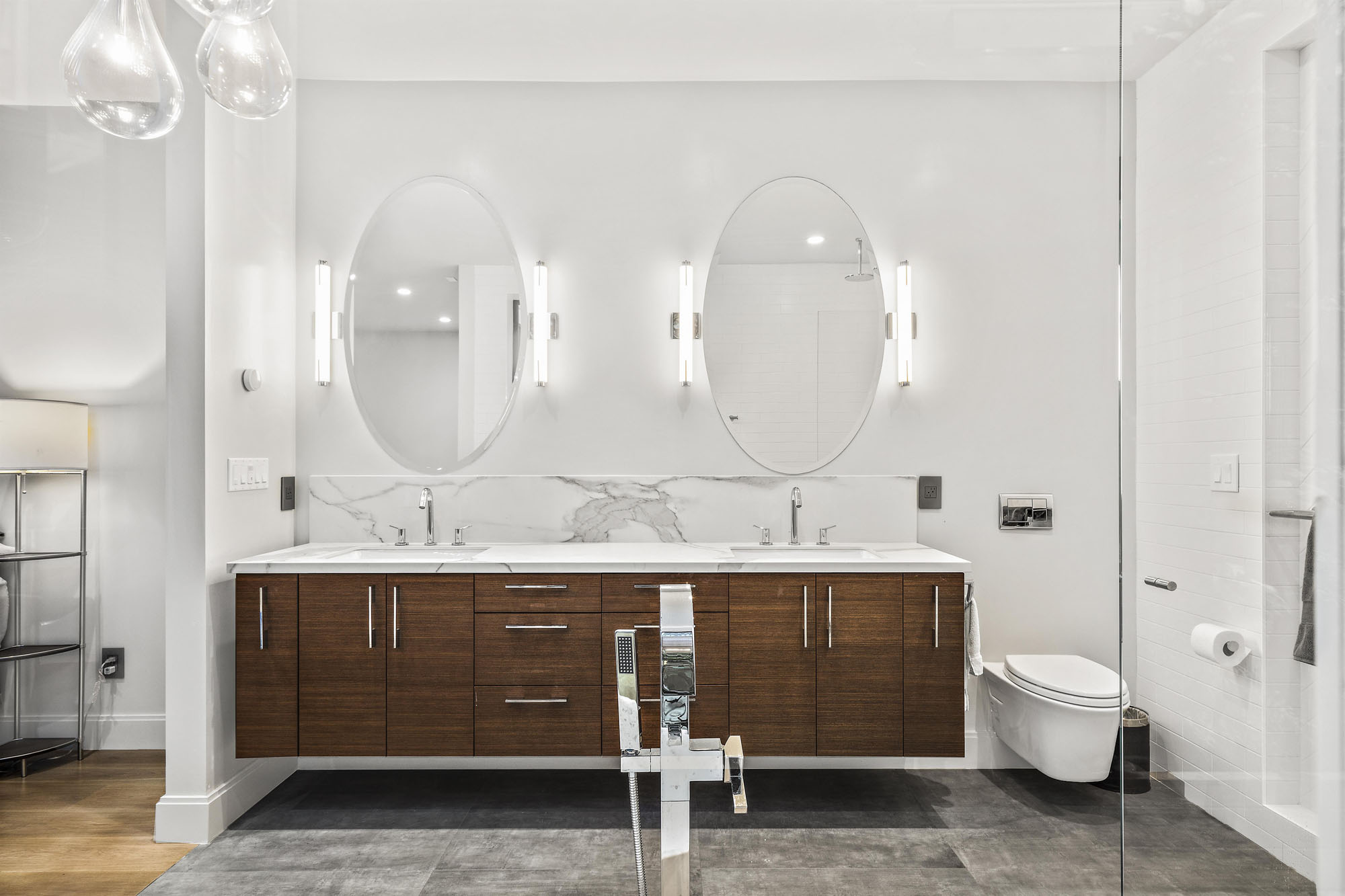 There is a double vanity with double mirrors in primary bathroom.