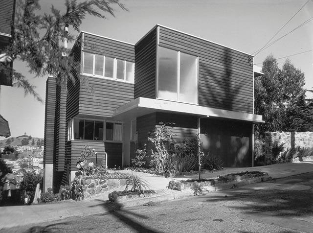 Exterior view of 90 Woodland Ave, showing a home with wood facade