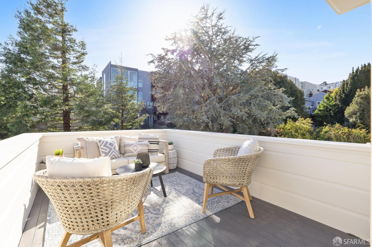 Patio off the guest room has sitting area.  There are some nice tall trees for privacy.
