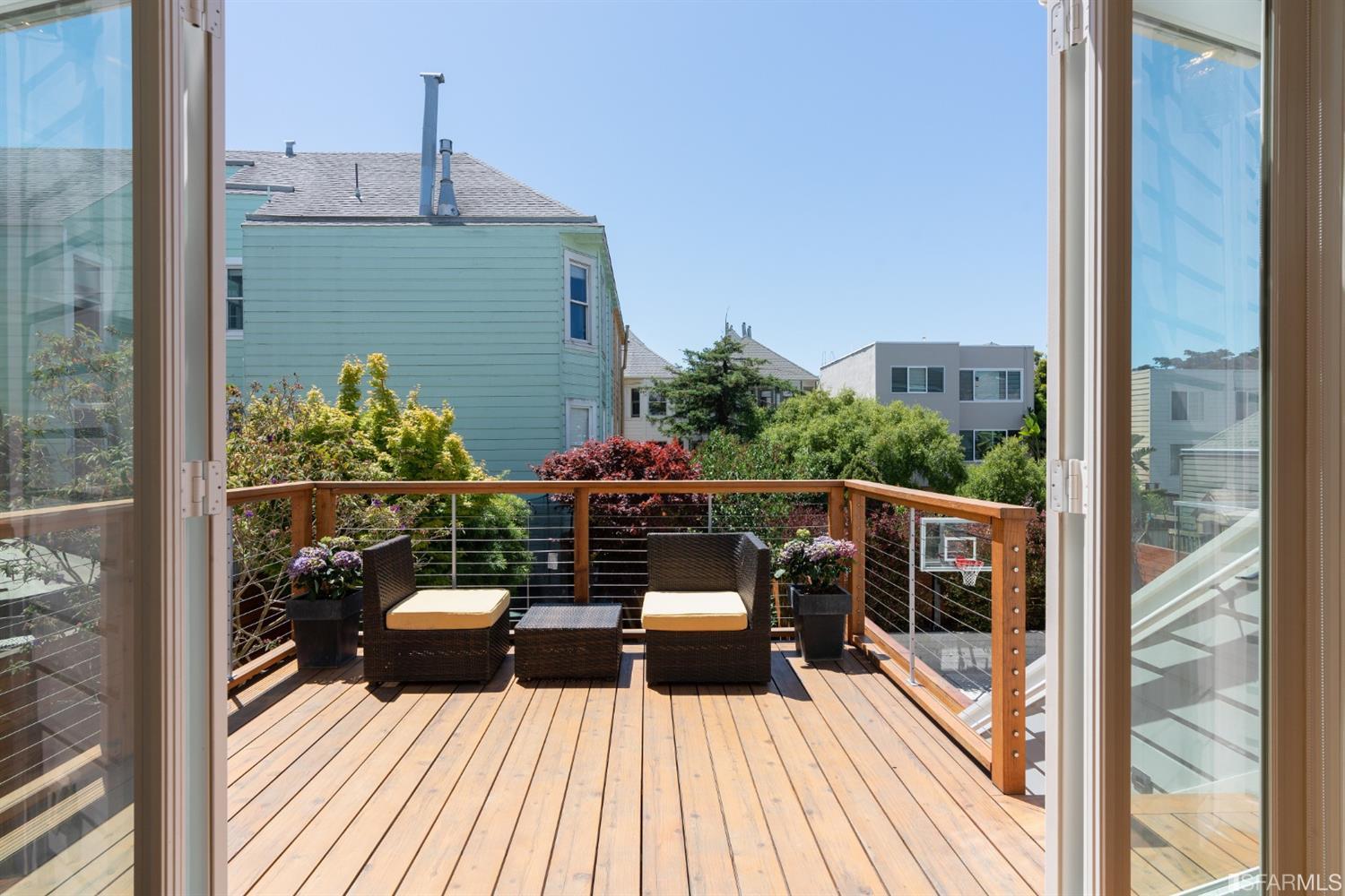Deck-1 View from open doors of the walk-out deck adjoining the kitchen