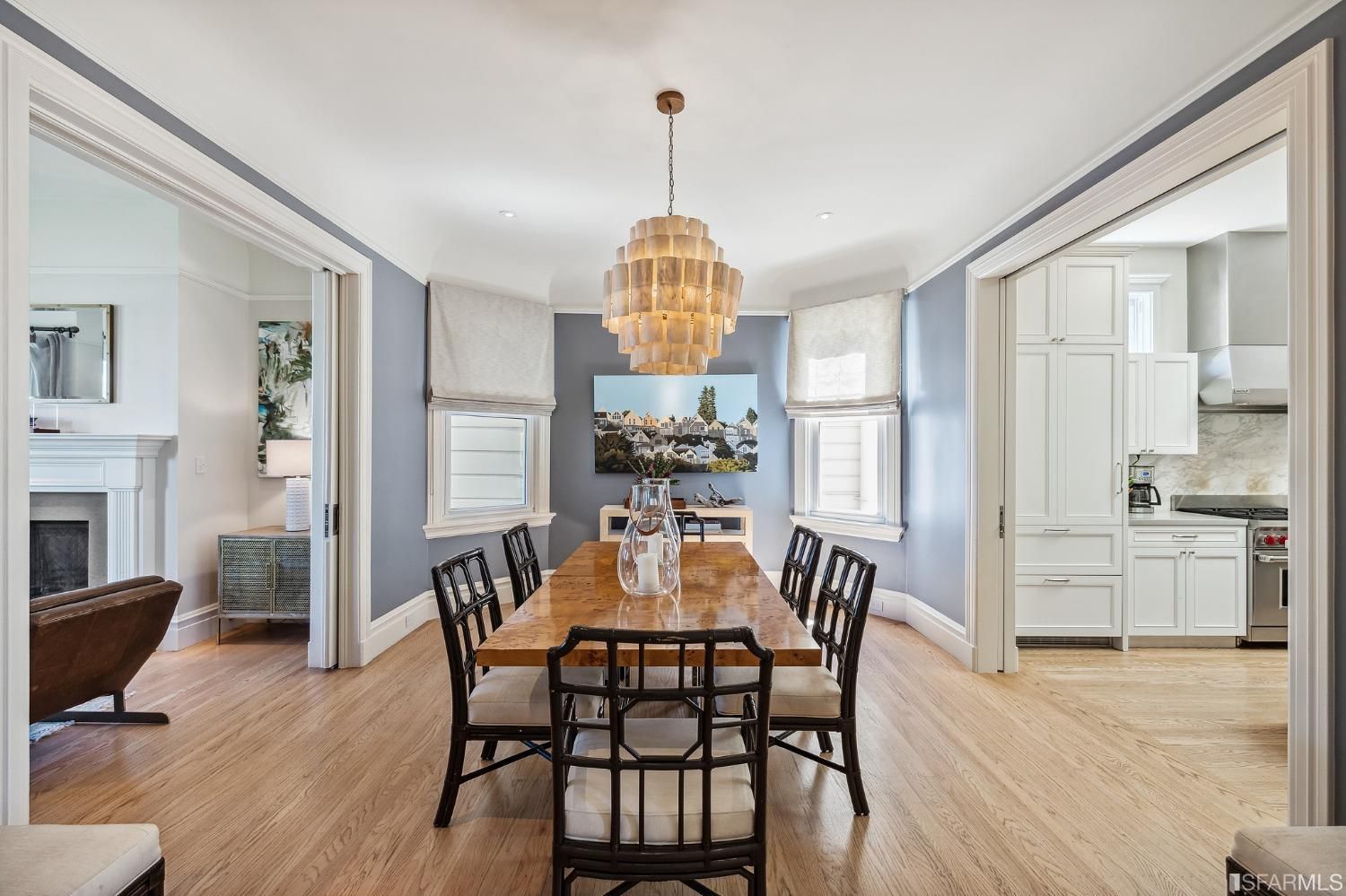 Dining room with living area to the left and kitchen to the right