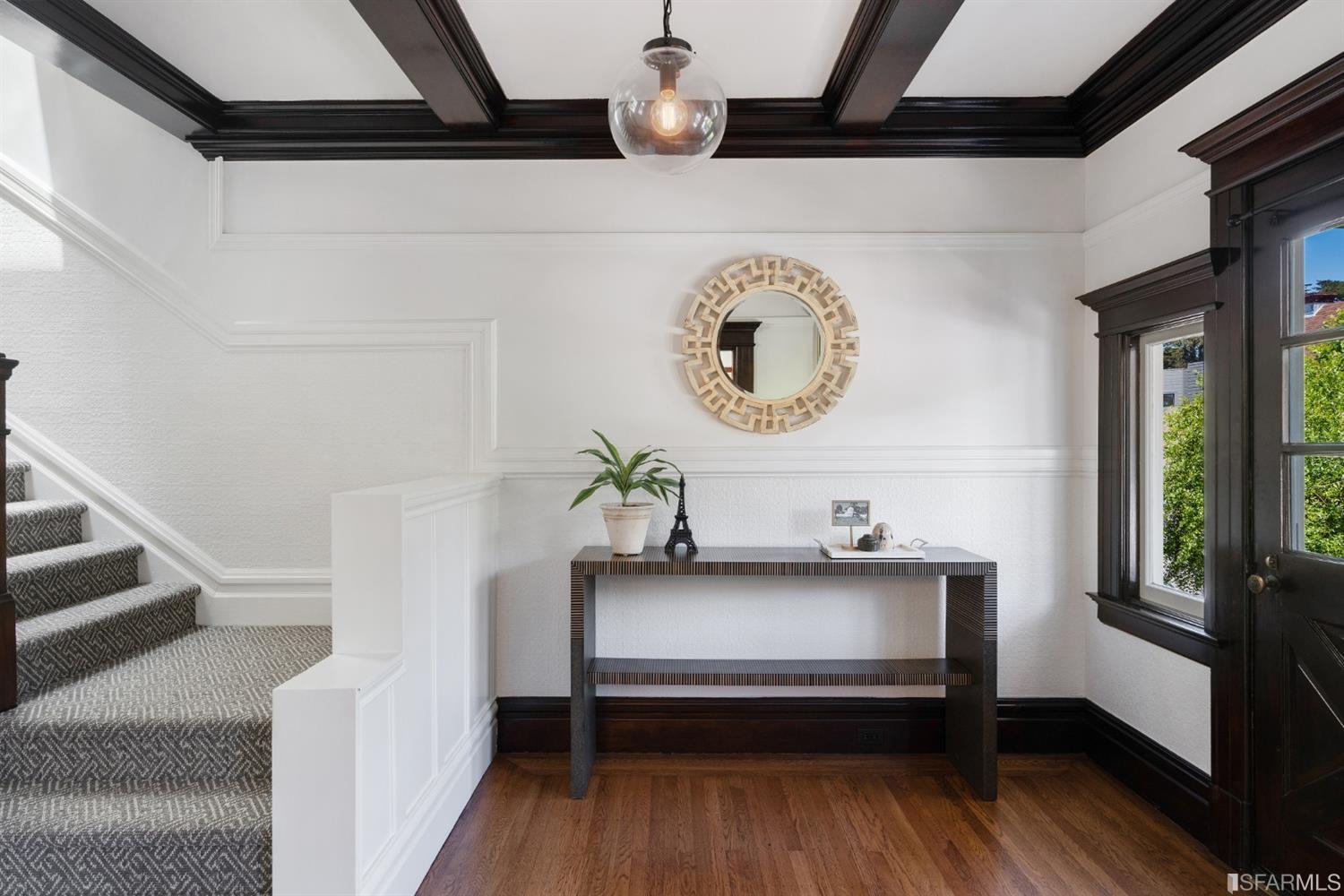 Entry Foyer, showing wood floors and wood beamed ceilings