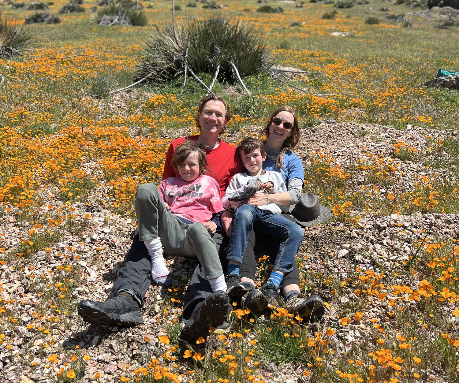 Happy home owners with family in a field