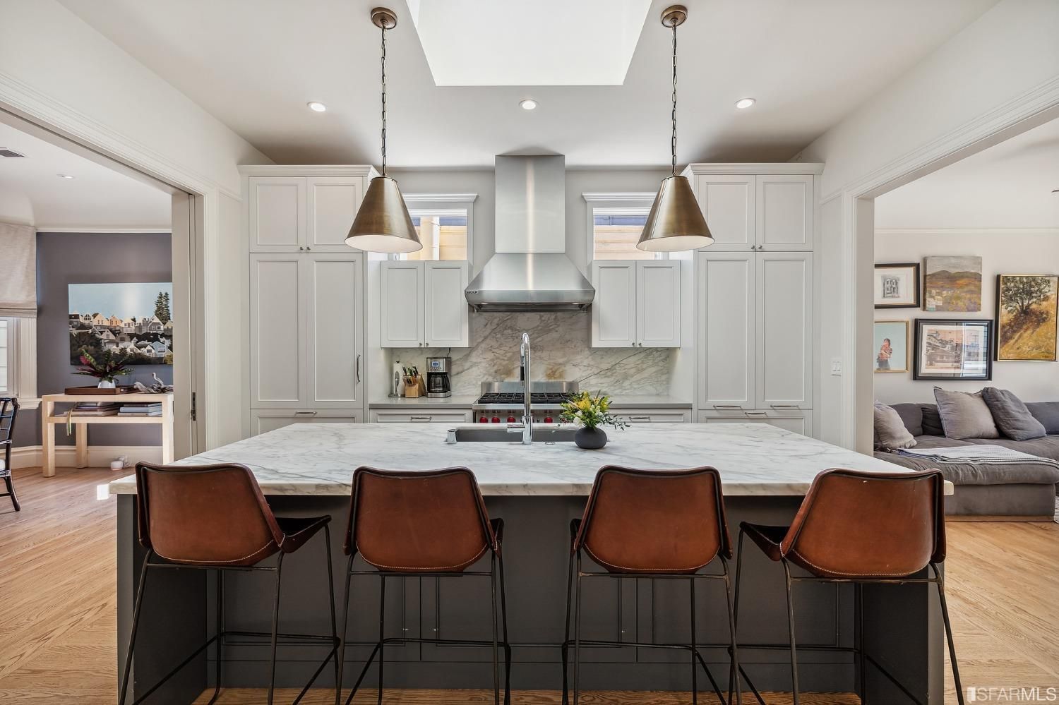 View of the large kitchen island with seating for four people