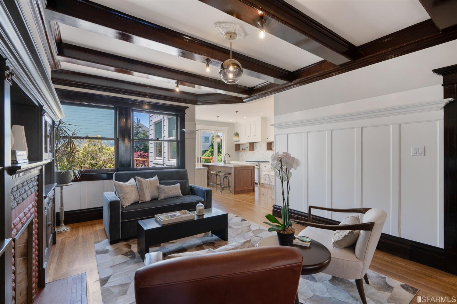 Living-kitchen Living area featuring wood floors and large windows