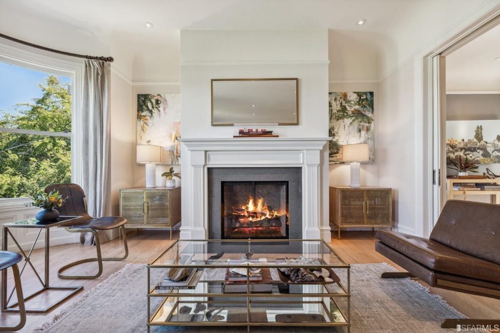 Living room with fireplace and wood mantle, as seen at 286 Fair Oaks St, purchased via John DiDomenico