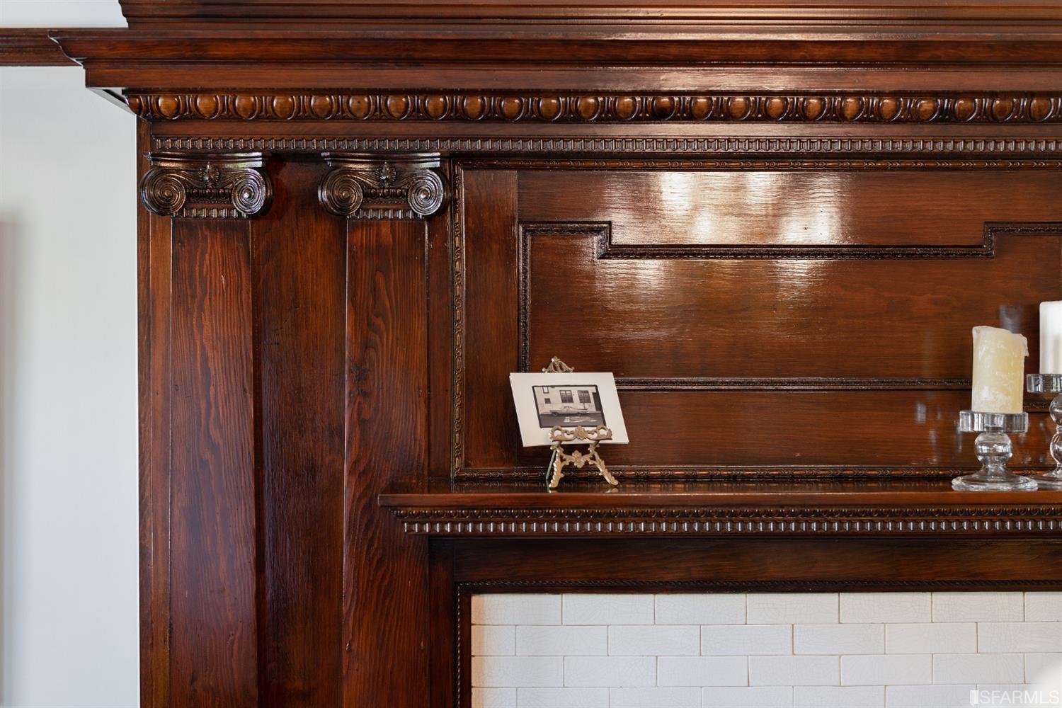 Mantle Close-up view of the ornate woodwork and craftsmanship of the fireplace mantle