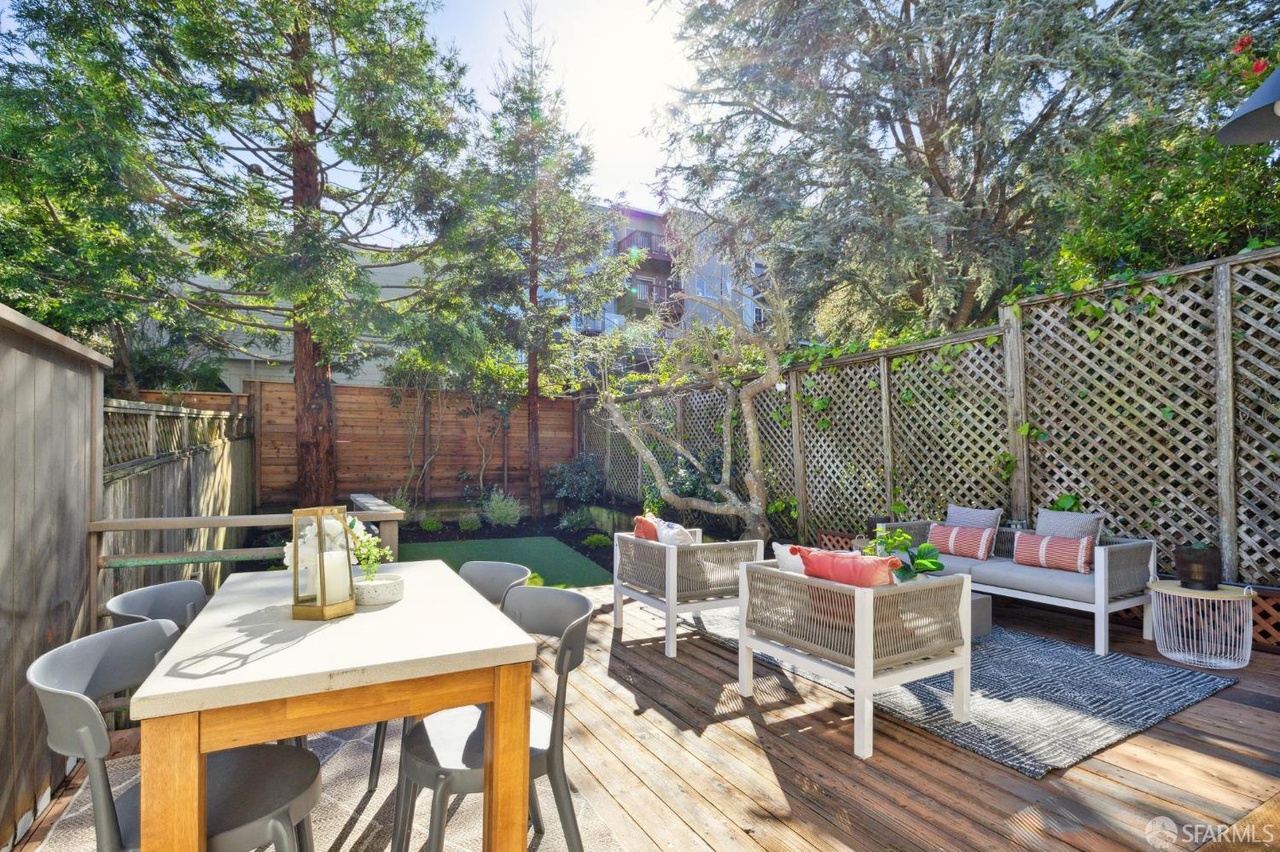 Outdoor area has deck with room for table and separate sitting area.