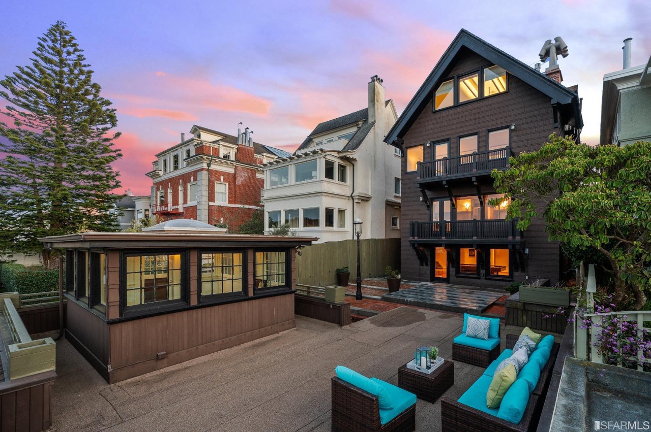 Outdoor-living Rear exterior view of 2212 Lake Street, showing a four level home and outdoor living space
