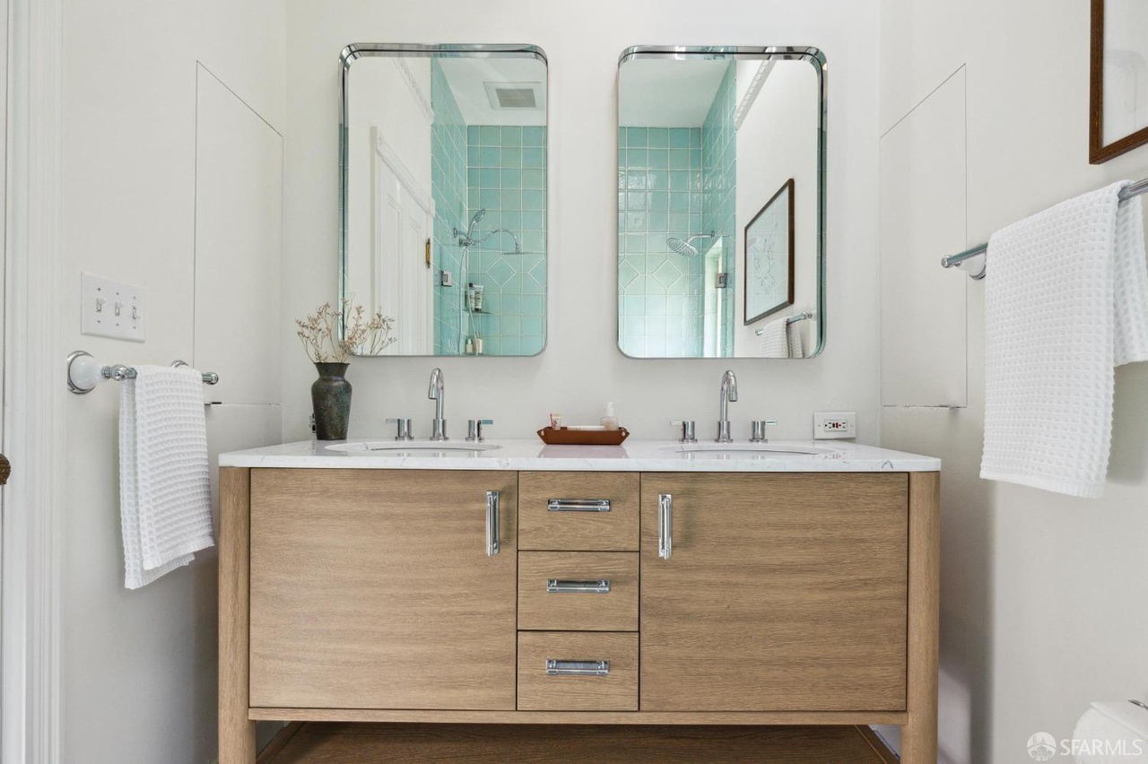Primary on suite bathroom has double vanity.