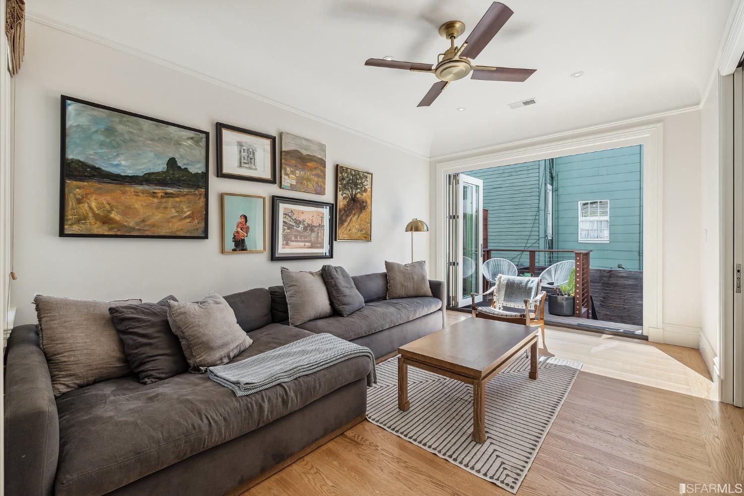 View of a second living area with open French doors leading to an outside living area