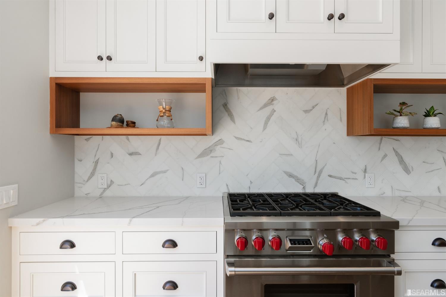 Stove Close-up view of the beautiful white cabinetry and chefs kitchen