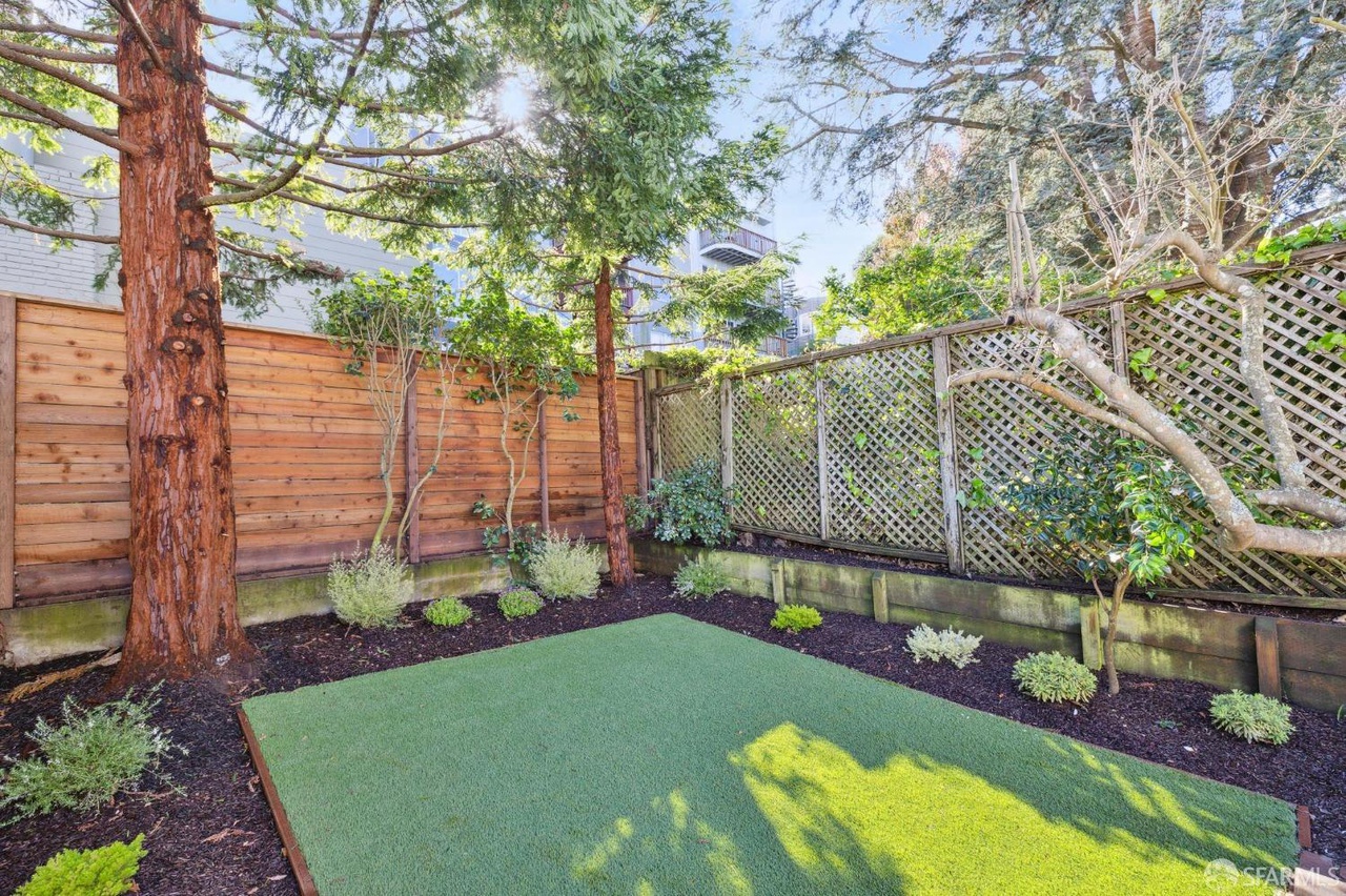 There is a turf grass area in back yard.