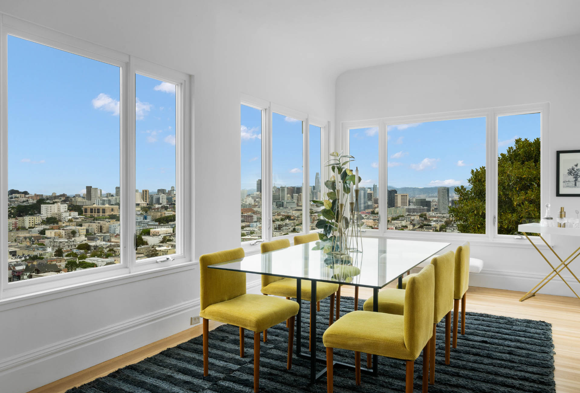dining-room-living-area-of171-173-Buena-vista-ave-east Dining room is surrounded by large windows looking at downtown San Francisco.