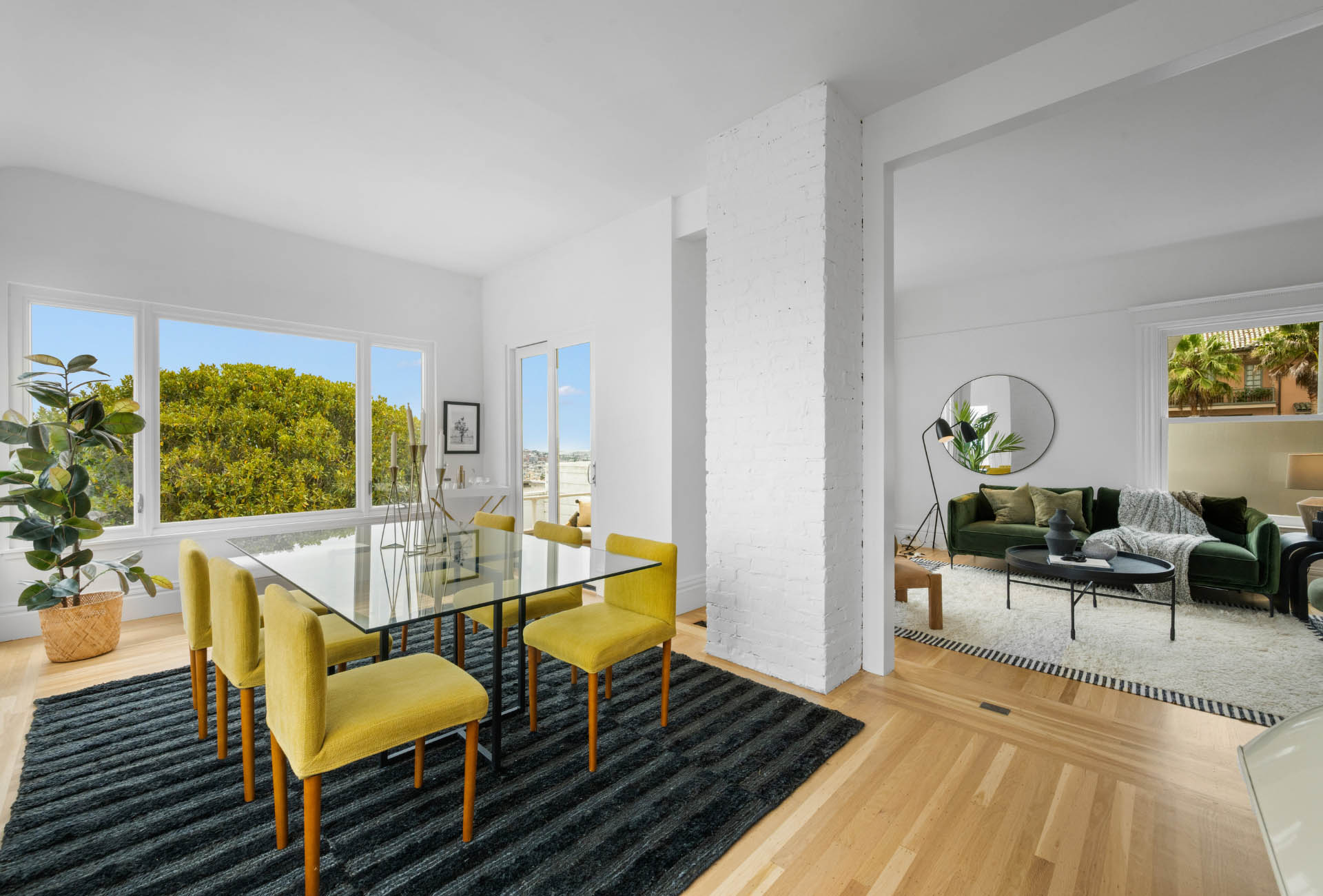 living-space-living-area-of171-173-Buena-vista-ave-east Dining room has a large glass rectangular table that seats six. It opens right up to the living room.
