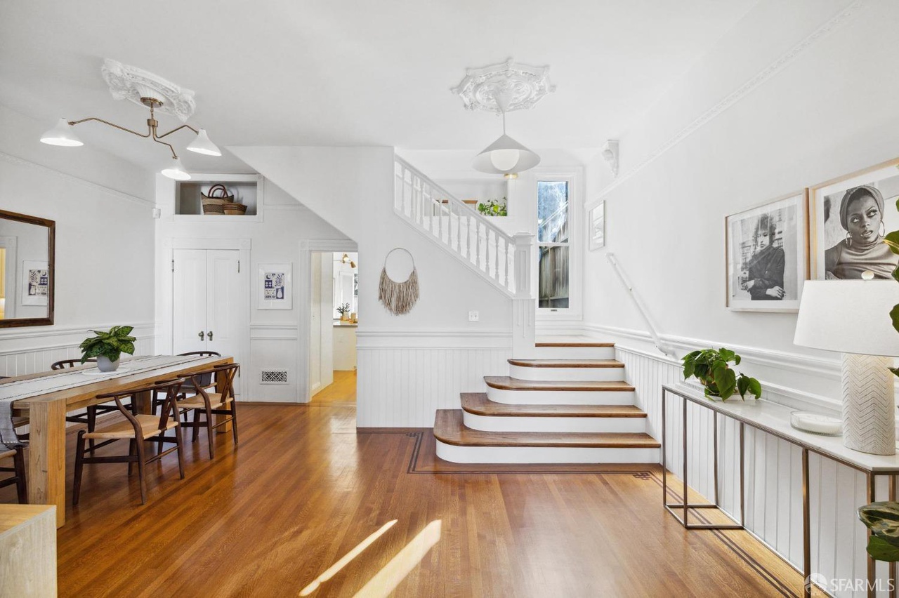 Main entry has dining room to the left and a staircare to the right.
